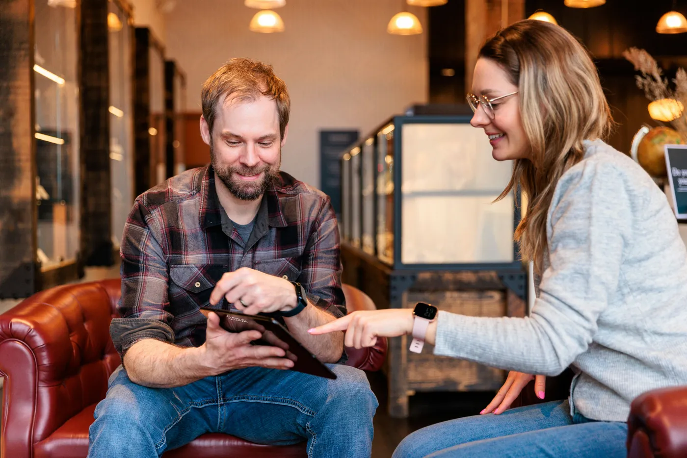 Vouchly customers reviewing a purchase in store